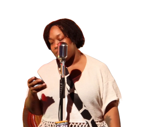 Penny Simmons performing spoken word at the microphone